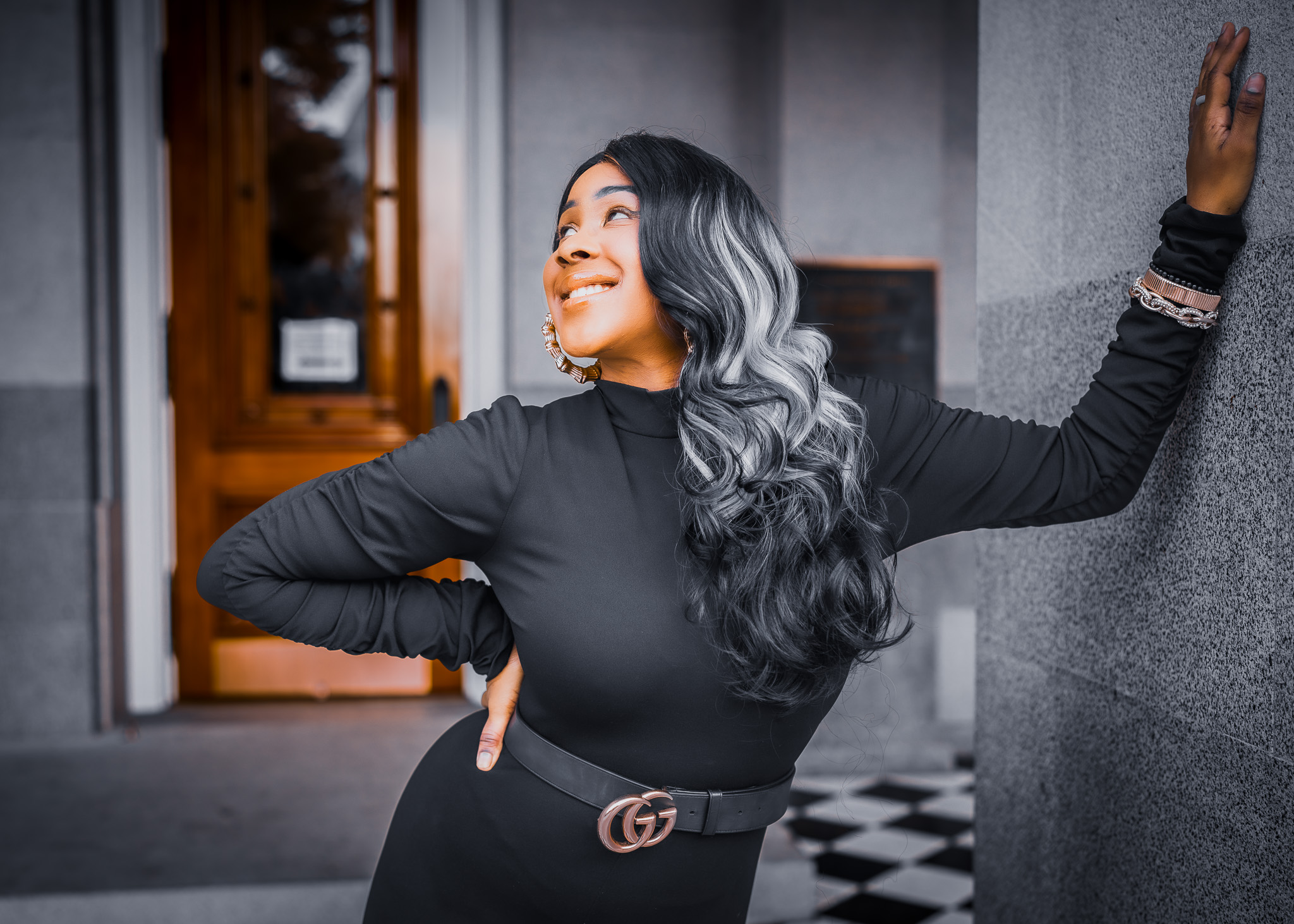 Besa in a black dress on location